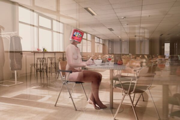 A nude person sits at a table in an empty room, eating from a bowl. Their head is replaced by the Lust box with colorful graphics—surreal and blurred, the image evokes motion or a dreamlike scene.